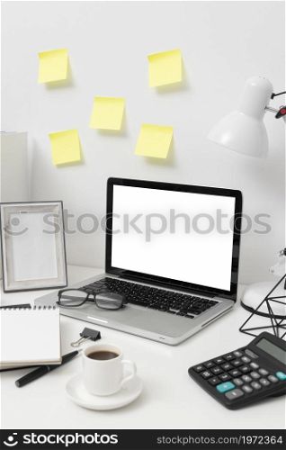 side view desk arrangement with post its wall. High resolution photo. side view desk arrangement with post its wall. High quality photo
