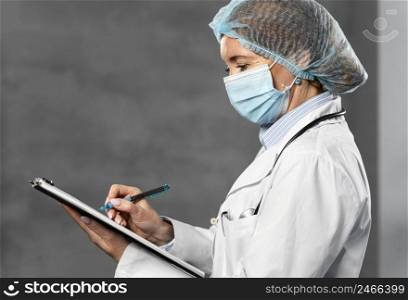 side view female doctor with medical mask hairnet holding clipboard with copy space