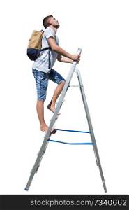 Side view full length portrait of a casual young man traveler climbing a ladder carrying a backpack looking up isolated over white background.