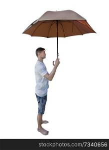 Side view full length portrait of casual young man holding umbrella as protection isolated over white background.
