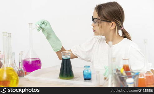 side view girl doing chemistry experiments