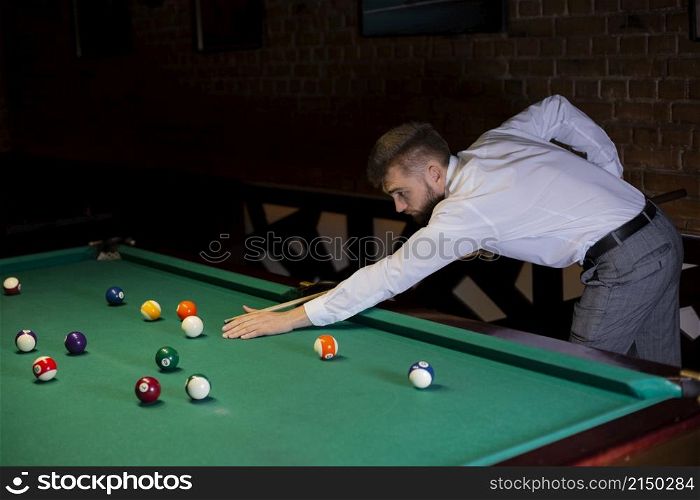 side view guy with pool cue