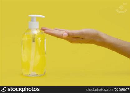 side view hand using liquid soap