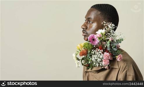 side view handsome man posing with bouquet flowers copy space