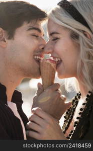 side view happy couple enjoying ice cream