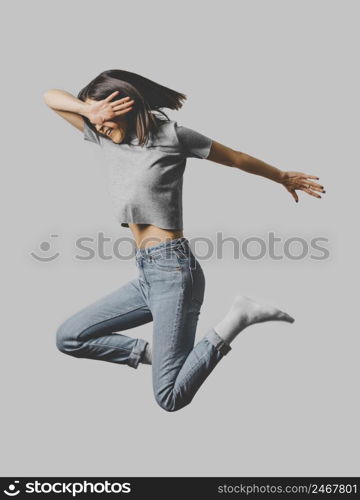 side view happy woman jumping air