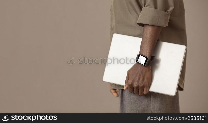 side view man holding laptop