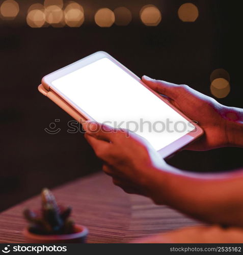 side view man holding tablet hands