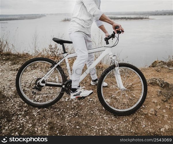 side view man riding mountain bike