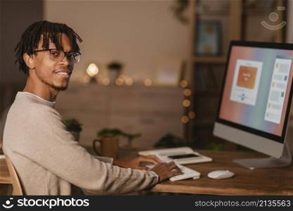 side view man using personal computer home