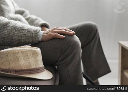 side view man with his hat nursing home. Resolution and high quality beautiful photo. side view man with his hat nursing home. High quality beautiful photo concept
