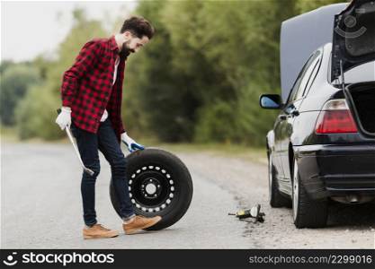 side view man with spare tire