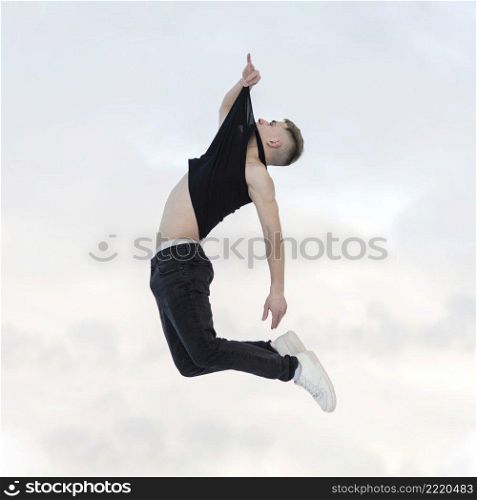 side view mid air pose by hip hop dancer