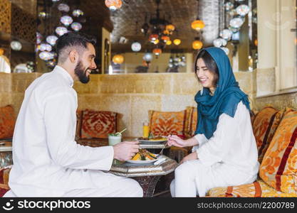 side view muslim couple arab restaurant