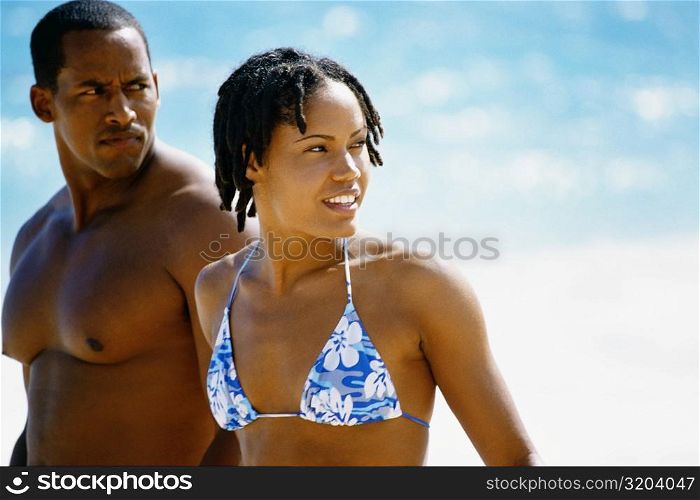 Side view of a couple in swimsuit , Horse-shoe Bay beach, Bermuda