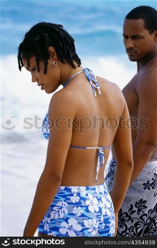Side view of a couple in swimsuits, Horse-shoe Bay beach, Bermuda