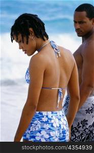 Side view of a couple in swimsuits, Horse-shoe Bay beach, Bermuda