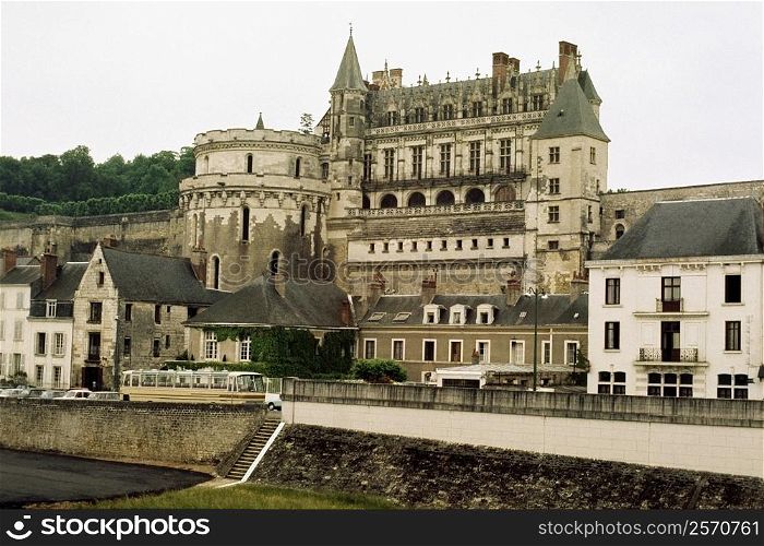 Side view of a grand chateau amidst a series of cottages, Amboise, France