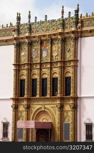 Side view of a pink building adorned with artwork, San Juan, Puerto Rico