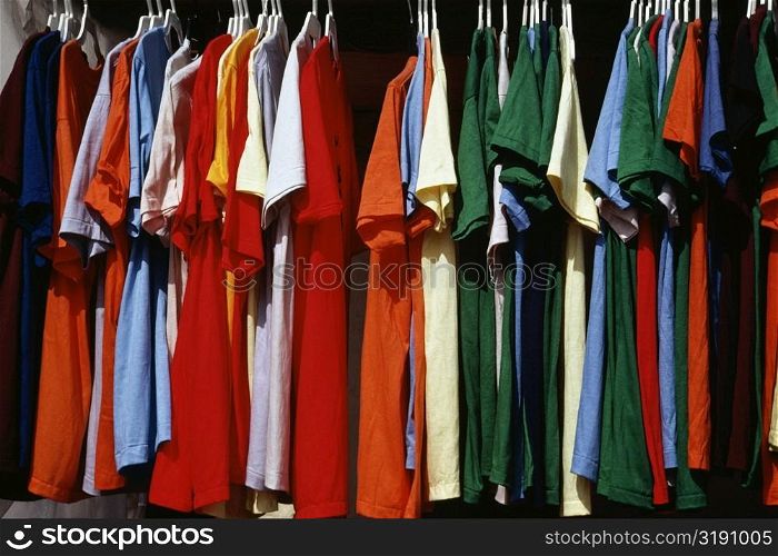 Side view of a row of colorful shirts displayed at a shop, Grand Bahamas, Bahamas
