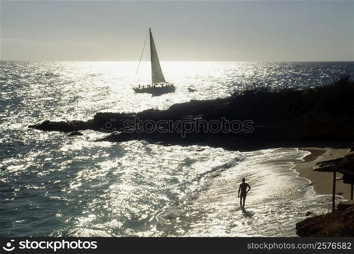 Side view of a sail boat sailing in a vast ocean , St. Martin, Caribbean