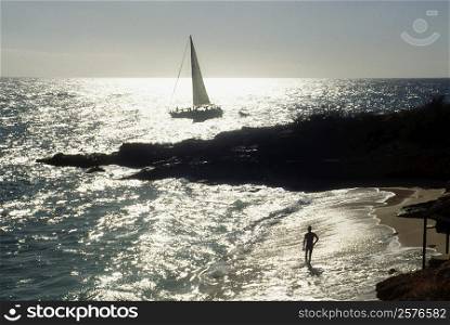 Side view of a sail boat sailing in a vast ocean , St. Martin, Caribbean