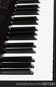 side view of black and white keys of digital sequencer close up