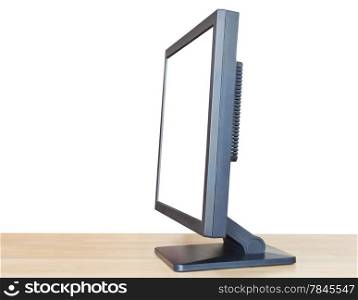 side view of black display with cutout screen on wood table isolated on white background