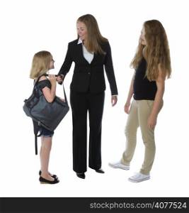 Side view of businesswoman and her young daughters greeting her as she comes home from work isolated on a white background