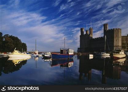 Side view of Caernarvon Castle from a river in Wales