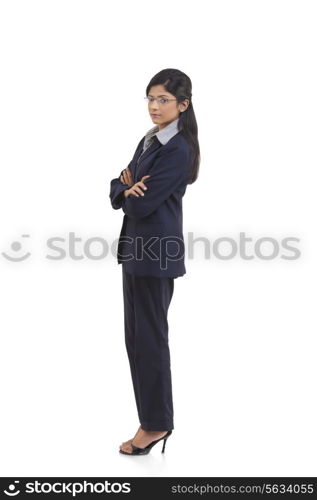 Side view of confident businesswoman with arms crossed isolated over white background