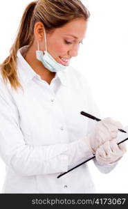 side view of doctor with writing pad against white background