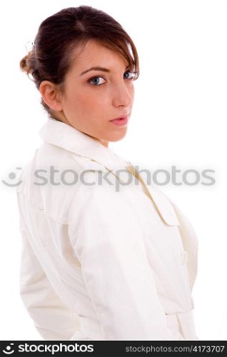 side view of fashionable female looking at camera on an isolated background