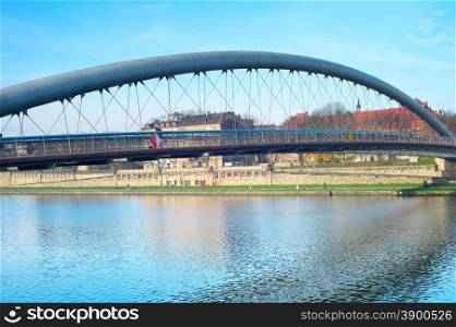 Side view of Father Bernatek Footbridge across the Wisla river. Krakow