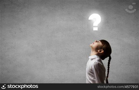 Side view of girl and question mark above her head