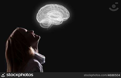 Side view of girl. Young thoughtful girl of school age looking up