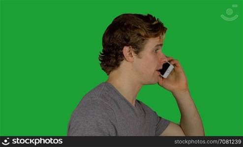 Side view of man talking on phone (Green Key)