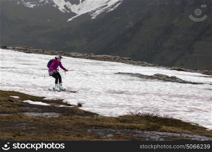Side view of person skiing in snow, Continental Divide, Hidden Lake Nature Trail, Logan Pass, Glacier National Park, Glacier County, Montana, USA