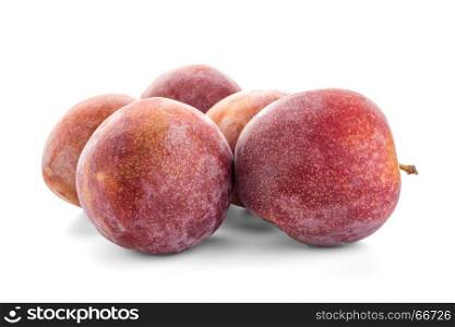 Side view of red ripe plums fruits isolated on white background
