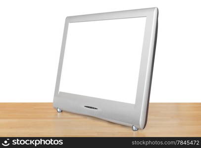 side view of silver TV set display with cut out screen on wooden table isolated on white background