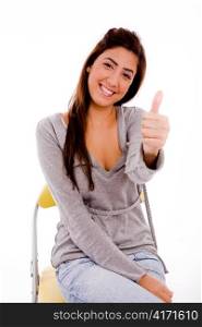 side view of smiling woman showing thumb up on an isolated background