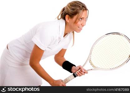 side view of tennis player going to play against white background