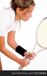 side view of tennis player with racket on an isolated white background