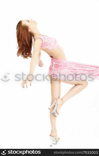 Side view of the dancing girl in pink, isolated