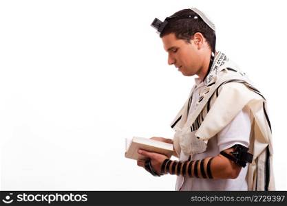 Side view of young jewish man with book on white isolated background