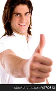 side view of young model with thumbsup against white background