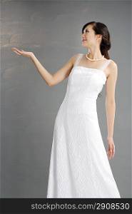 Side view of young woman wearing wedding dress