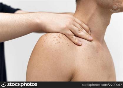 side view physiotherapist massaging man s neck