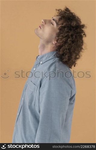 side view portrait curly haired young man