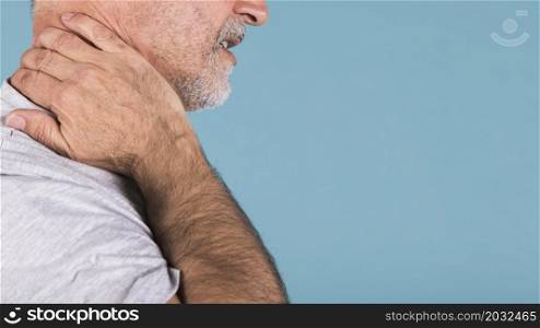 side view senior man suffering from neck pain